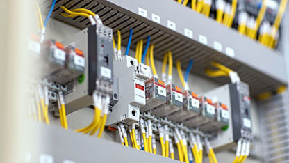 Electrical panel cabinet for industrial control, featuring power distribution, breaker boxes, and safety equipment ideal for electrical maintenance and wiring systems.