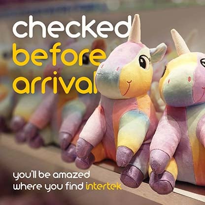 A row of colorful unicorn plush toys on a shelf