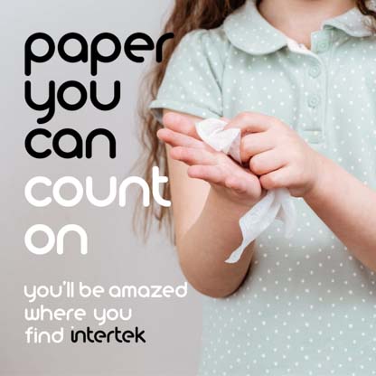 A child wiping her hands with a napkin