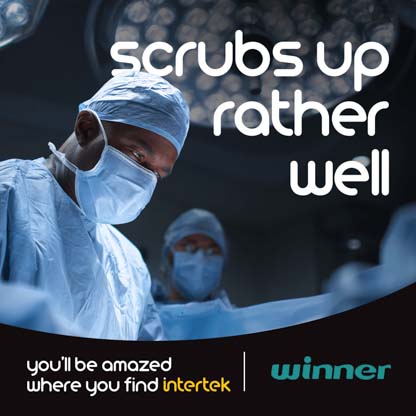 A medical professional wearing protective clothing during an operation