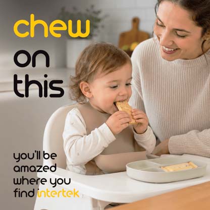 A mother watching as her infant daughter eats food