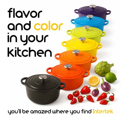 A set of colorful covered cookware arranged in a row next to fresh ingredients