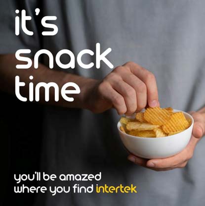 A man holding a bowl full of snack chips