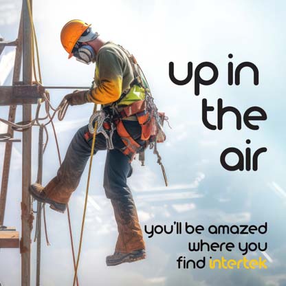 A construction worker working on a tower with PPE